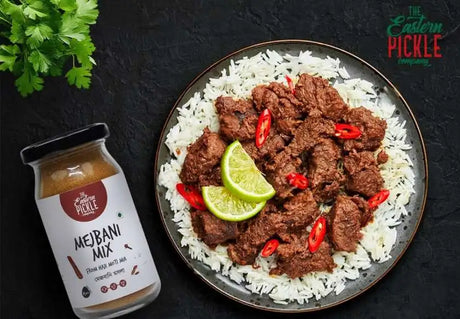 Mejbani mix masala (spice) with a rice bowl and mejban recipe - eastern pickle