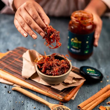 Someone is picking up Chalta Achar from a bowl | Eastern Pickle