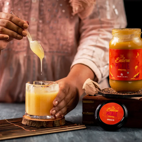 Eastern Pickle's Ghee pouring into a Jar