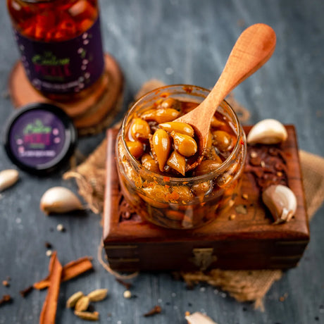 Garlic Pickle in a wooden spoon | Eastern Pickle