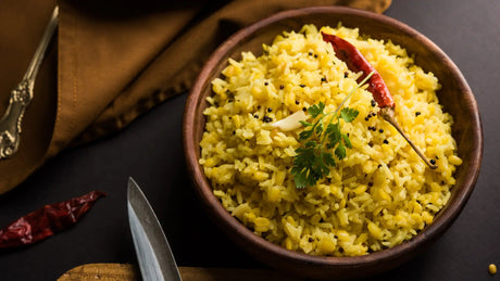 Delicious Khichuri in a bowl on a table by decorating with a red chili and dhoniya leaves